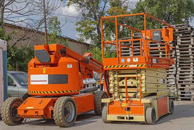 forklift operator organizing inventory in warehouse in Garden City Park NY